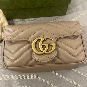 Mini Gucci bag. Beautiful Taupe/Tan color. Gold Chain.Used no more than 3 times